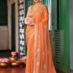 Orange Ethini Motifs Fancy Zari Embroidered Tissue Saree With Blouse Piece